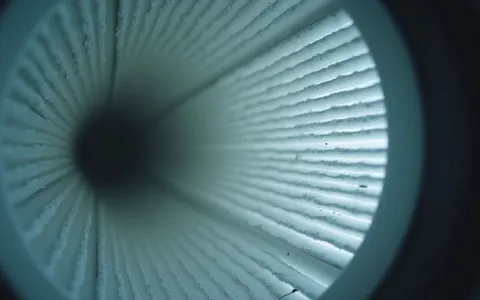 Close-up view of a HEPA air filter inside an HVAC system