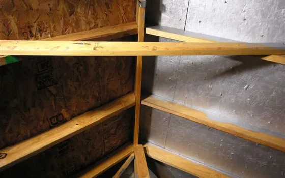 Reflective radiant barrier coating on the underside of a roof deck
